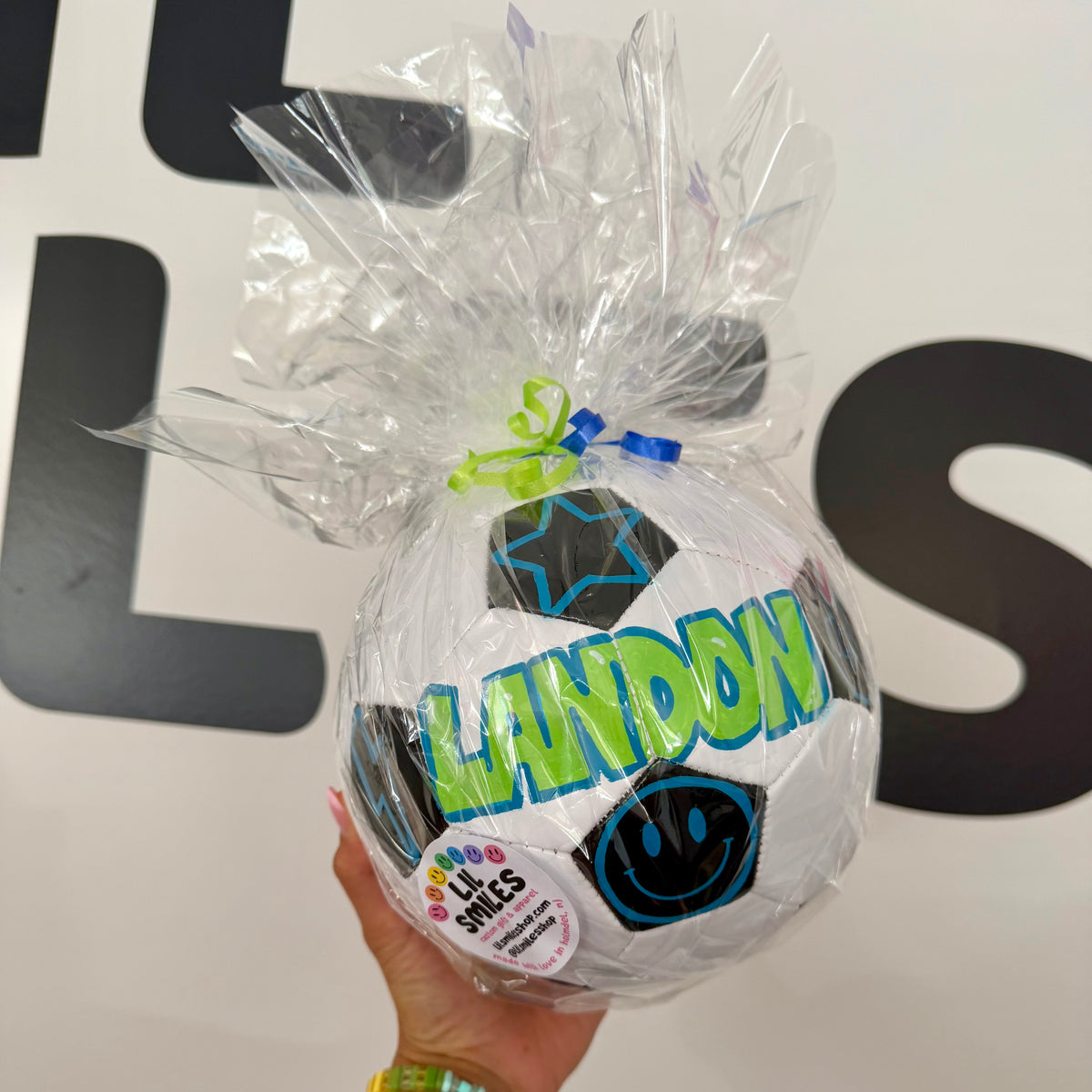Personalized hand-painted soccer ball wrapped and ready for gifting