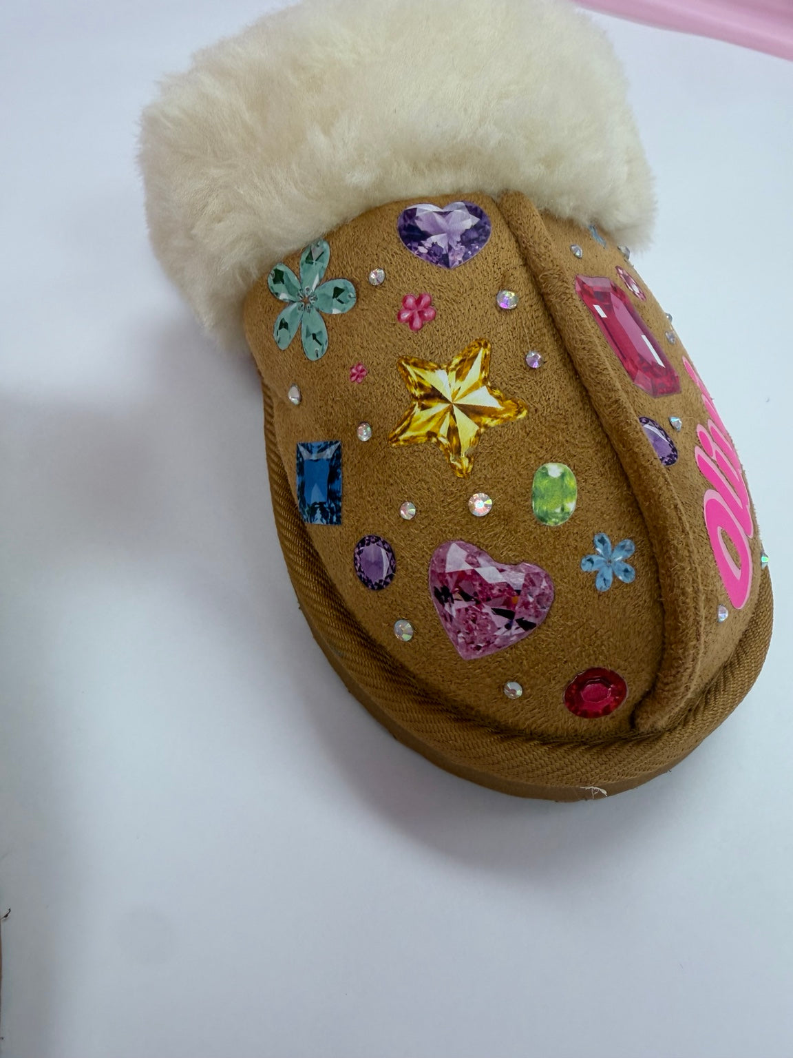 Side detail of personalized gem decorated faux fur slipper