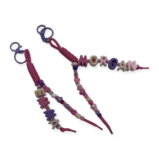 Personalized chunky name bag charm keychain with pink cord, purple clasp and custom letter beads, handmade beaded keychain for backpacks